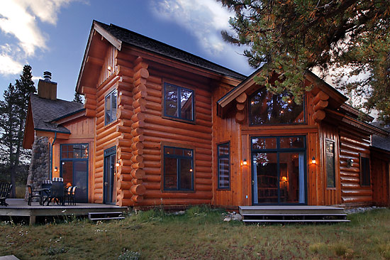Roof lines add interest to this handcrafted log house