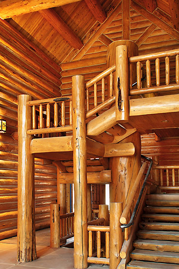 Log staircase in a handcrafted log lodge