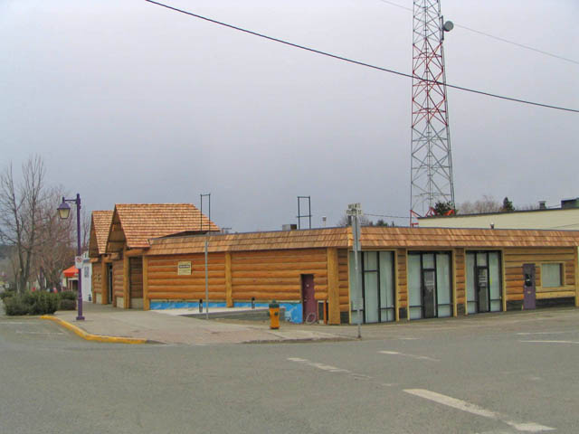 100 Mile House municipal building before log accents