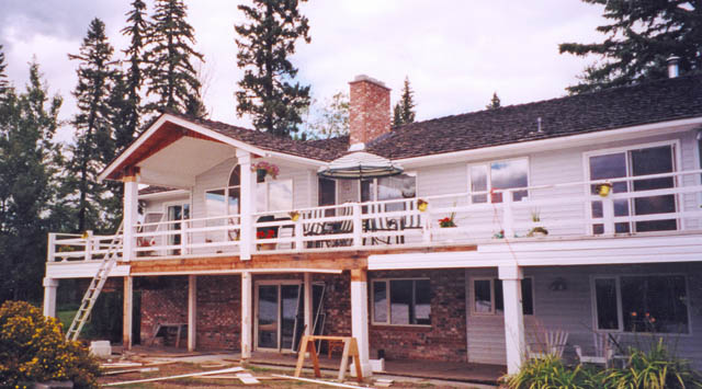 100 Mile House municipal building before log accents