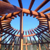 Log dance arbor constructed by Sitka Log Homes