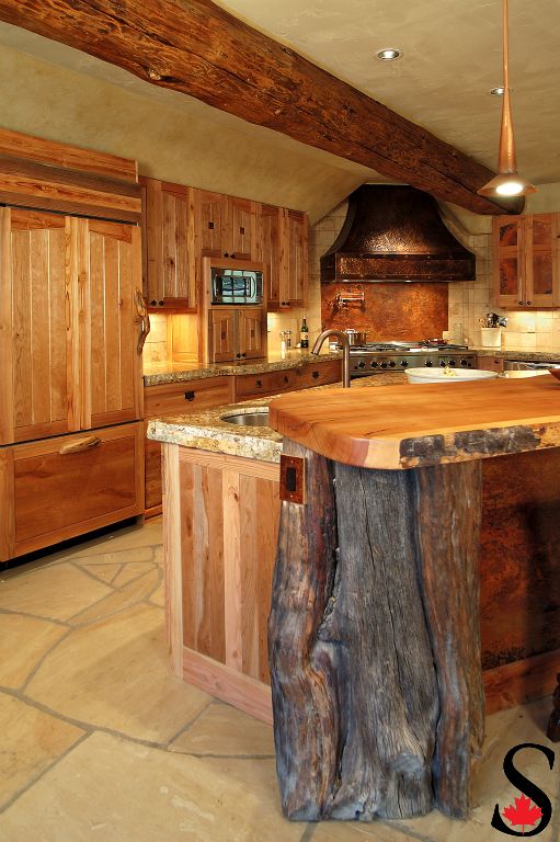 Wood slab island and granite countertop.