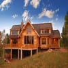 country log house with log railings on sundeck