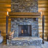 Stone fireplace with timber mantle