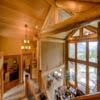 Looking down to great room in resort log home in Sun Peaks Resort, BC