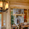 Great room with log mantle in resort log home in Sun Peaks Resort, BC