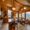 Kitchen and dining in resort log home in Sun Peaks Resort, BC