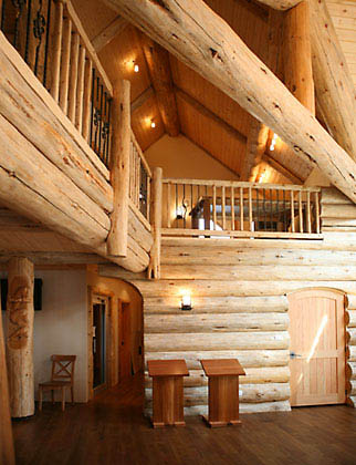 The handcrafted log lodge blends rustic style with high tech