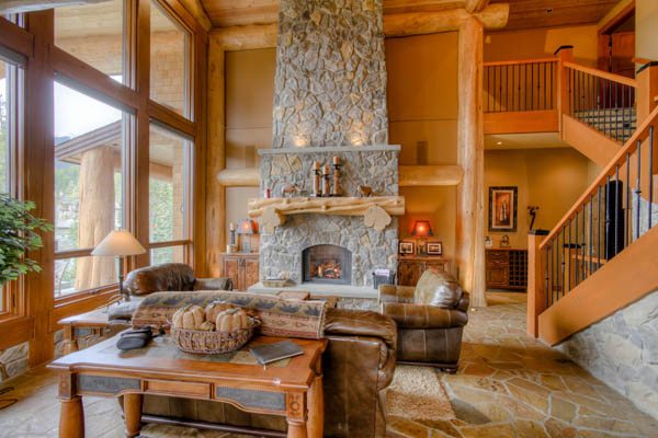 stone fireplace with log mantle